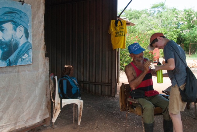 Jeremy talks with one of the farmers at Organoponico Alamar about his life and experience. (Photo by Britt Basel)